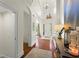 Welcoming foyer with hardwood floors, wainscoting, and a grand chandelier at 4896 Locklear Way, Marietta, GA 30066