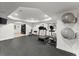 Home gym featuring modern exercise equipment, rubber floor, and neutral color palette at 4896 Locklear Way, Marietta, GA 30066