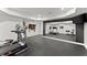 Spacious home gym with rubber floor, mirrored wall, and modern exercise equipment at 4896 Locklear Way, Marietta, GA 30066