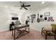 Home office complete with a modern desk, ceiling fan, and decorative wall art at 4896 Locklear Way, Marietta, GA 30066