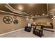 Inviting home theater featuring comfortable seating, projector, and decorative film reels at 4896 Locklear Way, Marietta, GA 30066