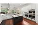Well-equipped kitchen features stainless steel appliances, an island, and open flow to the living area at 4896 Locklear Way, Marietta, GA 30066