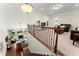 Open-concept living area with fireplace and comfortable seating, viewed from the staircase at 4896 Locklear Way, Marietta, GA 30066