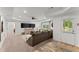 Expansive living room features a ceiling fan, modern furniture, and sliding glass door at 4896 Locklear Way, Marietta, GA 30066