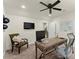 Comfortable office space featuring a ceiling fan, desk, computer setup, and chair at 4896 Locklear Way, Marietta, GA 30066