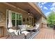 Covered porch with wicker seating and outdoor furnishings at 4896 Locklear Way, Marietta, GA 30066