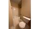Clean bathroom with white tile surround tub and toilet at 213 Peartree Ln, Riverdale, GA 30274