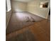 Spacious room with a window, new carpet, and a view into the kitchen at 213 Peartree Ln, Riverdale, GA 30274