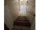 Stairway leading downstairs with tile flooring at 213 Peartree Ln, Riverdale, GA 30274