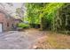 View of the backyard featuring green foliage and a partially fenced perimeter at 2582 Springdale Sw Rd, Atlanta, GA 30315