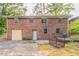 Brick house backyard featuring a garage and fenced yard at 2582 Springdale Sw Rd, Atlanta, GA 30315