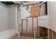 Unfinished bathroom area in the basement with framing and stubbed-in plumbing fixtures at 2582 Springdale Sw Rd, Atlanta, GA 30315