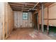 Unfinished basement showing exposed framing and utilities, awaiting transformation at 2582 Springdale Sw Rd, Atlanta, GA 30315