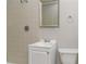 Bright bathroom with tiled shower, white vanity, and essential fixtures at 2582 Springdale Sw Rd, Atlanta, GA 30315