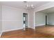 Traditional dining room with hardwood floors, neutral walls, and view to living area at 2582 Springdale Sw Rd, Atlanta, GA 30315