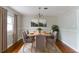 Inviting dining room with hardwood floors, a stylish chandelier, and a serene atmosphere at 2582 Springdale Sw Rd, Atlanta, GA 30315