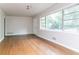 Bright living room with hardwood floors, a large window, and neutral paint at 2582 Springdale Sw Rd, Atlanta, GA 30315