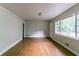 Bright living room featuring hardwood floors, neutral paint, and large windows for natural light at 2582 Springdale Sw Rd, Atlanta, GA 30315