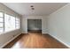 Spacious living room featuring hardwood floors, neutral paint, and large windows for natural light at 2582 Springdale Sw Rd, Atlanta, GA 30315