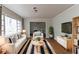 Bright living room features hardwood floors, neutral paint, and large windows for natural light at 2582 Springdale Sw Rd, Atlanta, GA 30315