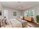 Serene main bedroom with hardwood floors, ample natural light, and calming neutral tones at 2582 Springdale Sw Rd, Atlanta, GA 30315