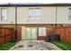 Backyard featuring a patio, exterior door, and fence at 3184 Nectarine Cir, Decatur, GA 30034