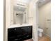 Bathroom featuring a black vanity and mirror at 3184 Nectarine Cir, Decatur, GA 30034