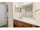 Bathroom featuring a wood vanity with gray toned marble countertop and mirror at 3184 Nectarine Cir, Decatur, GA 30034