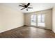 Bright bedroom featuring a ceiling fan and windows for natural light at 3184 Nectarine Cir, Decatur, GA 30034