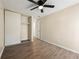 Bedroom with a ceiling fan, hardwood floors, and spacious closet at 3184 Nectarine Cir, Decatur, GA 30034