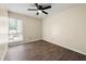 Well-lit bedroom featuring hardwood floors and a ceiling fan at 3184 Nectarine Cir, Decatur, GA 30034