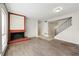 Spacious living room featuring a brick fireplace, hardwood floors and staircase at 3184 Nectarine Cir, Decatur, GA 30034