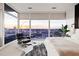 Modern bedroom featuring floor-to-ceiling windows with city views and stylish furniture at 45 Ivan Allen Jr Nw Blvd # 2505, Atlanta, GA 30308