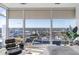 Stunning city views from this primary bedroom's floor-to-ceiling windows and a stylish seating area at 45 Ivan Allen Jr Nw Blvd # 2505, Atlanta, GA 30308
