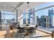 Bright dining area with modern table, chairs, and floor-to-ceiling windows overlooking the cityscape at 45 Ivan Allen Jr Nw Blvd # 2505, Atlanta, GA 30308