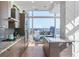 Well-lit kitchen featuring granite countertops, stainless steel appliances, and scenic city views at 45 Ivan Allen Jr Nw Blvd # 2505, Atlanta, GA 30308