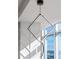 Unique lighting fixture with square and circle LED feature, installed adjacent to a large window at 45 Ivan Allen Jr Nw Blvd # 2505, Atlanta, GA 30308