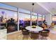 Dining and living space with floor-to-ceiling windows showcasing stunning city views at 45 Ivan Allen Jr Nw Blvd # 2505, Atlanta, GA 30308