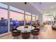 Open living and dining area with floor-to-ceiling windows offering breathtaking city skyline views at 45 Ivan Allen Jr Nw Blvd # 2505, Atlanta, GA 30308