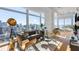 Bright living room featuring hardwood floors, expansive windows, and stylish contemporary furnishings with city views at 45 Ivan Allen Jr Nw Blvd # 2505, Atlanta, GA 30308