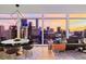 Modern living and dining area with stylish furniture and expansive city views through large windows at 45 Ivan Allen Jr Nw Blvd # 2505, Atlanta, GA 30308