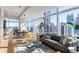 Sleek living room boasting floor-to-ceiling windows, modern furnishings, and breathtaking city views at 45 Ivan Allen Jr Nw Blvd # 2505, Atlanta, GA 30308