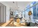 Open concept living space with sleek kitchen, dining area, and expansive windows offering stunning city views at 45 Ivan Allen Jr Nw Blvd # 2505, Atlanta, GA 30308