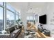 Bright, contemporary living room with floor-to-ceiling windows offering panoramic city views at 45 Ivan Allen Jr Nw Blvd # 2505, Atlanta, GA 30308