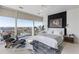 Modern bedroom with city views, hardwood floors, and a seating area for relaxing and enjoying the scenery at 45 Ivan Allen Jr Nw Blvd # 2505, Atlanta, GA 30308