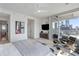 Serene primary bedroom with private balcony and skyline view, featuring modern lighting and sleek furniture at 45 Ivan Allen Jr Nw Blvd # 2505, Atlanta, GA 30308