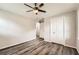 Bedroom with hardwood floors, neutral paint, ceiling fan, and closet space at 62 Sunny Ln, Villa Rica, GA 30180
