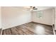 Bright bedroom featuring hardwood floors, neutral walls, and a ceiling fan at 62 Sunny Ln, Villa Rica, GA 30180