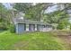 A charming single-story home with a gray brick facade, a white railing on the front porch, and a well-kept lawn at 62 Sunny Ln, Villa Rica, GA 30180