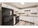 Efficient kitchen featuring a gas stove, stainless steel refrigerator, and granite countertops at 62 Sunny Ln, Villa Rica, GA 30180
